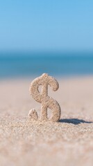 Dollar symbol made of sand standing on a beach. Concept of financial investment, wealth, and money for summer vacation.
