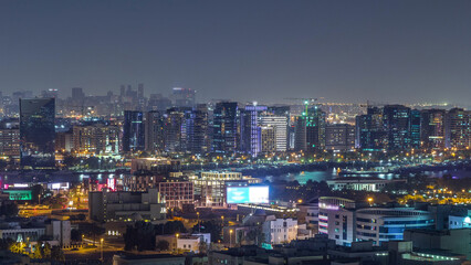 Aerial view of neighborhood Deira with typical buildings night timelapse, Dubai, United Arab Emirates