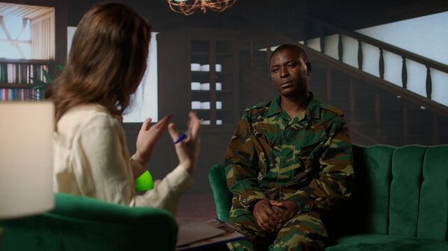 Psychotherapy session for an armed forces veteran in distress and grief, showcasing therapy for PTSD, trauma and reintegration after combat. Soldier dealing with war flashbacks. Camera A.