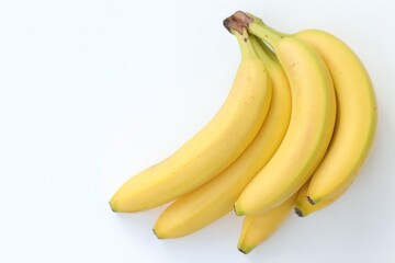 Bananas on a white background, top view, free space, summer