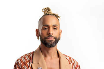 Confident black gay man standing isolated on white background, dressed in a bold, colorful jacket....