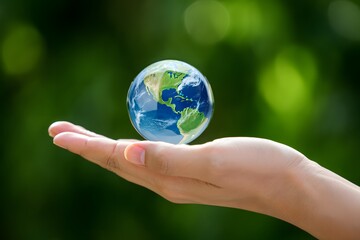 Earth day concept save the planet globe in hand environmental protection and care