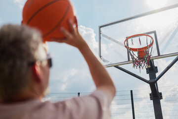 Perfecting the jump shot at a sunny outdoor court
