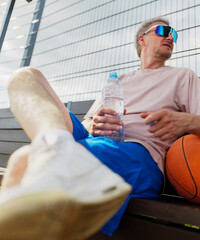 Relaxing with water and basketball after practice