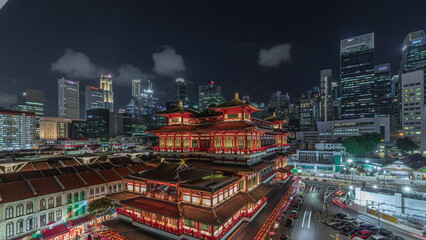 The Buddha Tooth Relic Temple comes alive at night timelapse in Singapore Chinatown, with the city...