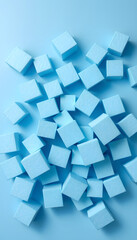 Randomly lying blue foam cubes. Graphic concept. Blue foam cut into cubes. Blue background. Volumetric image. Styrofoam, Side lit. White tone