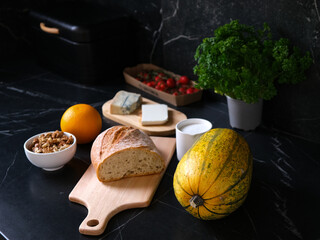 Ingredients for recipe of toast with pumpkin caramelized in orange juice with cheese and nuts
