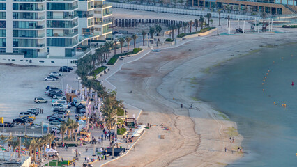 Beach on Al Reem island in Abu Dhabi during sunset timelapse from above. © HyperlapsePro