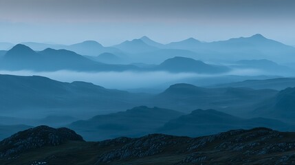 Misty mountain range at dawn