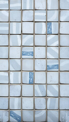 Old blue white gray vintage shabby patchwork tiles stone concrete cement wall texture background, cinematic. White tone