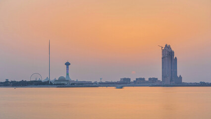 Naklejka premium Sunset in Abu Dhabi over Marina Island timelapse