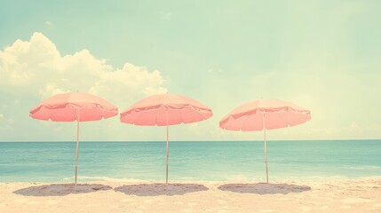 Pink beach umbrellas, ocean backdrop, sunny day, vacation