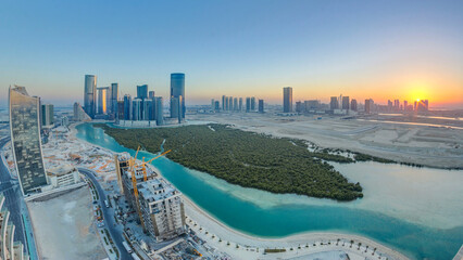Buildings on Al Reem island in Abu Dhabi at sunset timelapse from above. © HyperlapsePro