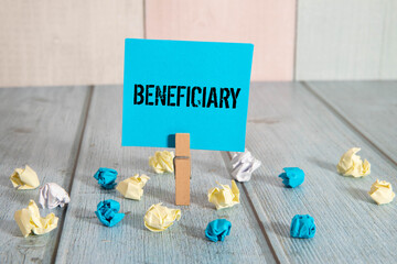 Torn Piece of Paper With the Word Beneficiary
