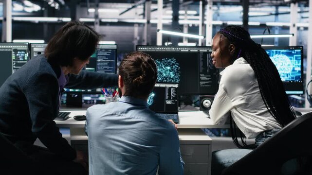 Server room computer scientists using AI to review infrastructure diagnostics. IT specialists working together in data center, analyzing performance data using artificial intelligence tech, camera A - Powered by Adobe