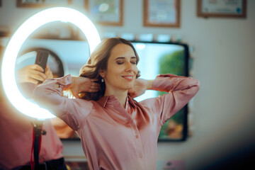 Hairstylist Takes a Picture of the Final Look of her Client. Happy woman showing off results after...