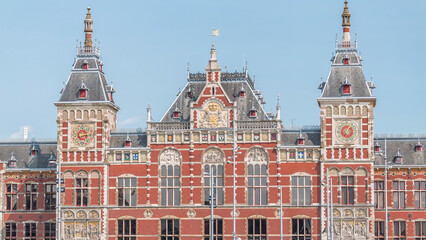 Timelapse of Amsterdam Central Railway Station front view. Amsterdam, The Netherlands