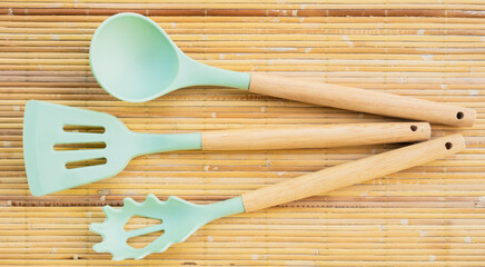 flat lay of kitchen tools on a bamboo mat