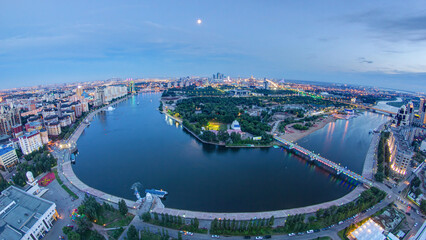 Obraz premium Elevated view over the city center with river and park and central business district day to night Timelapse, Kazakhstan, Astana