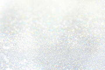 Obraz premium Shiny silver background with sparkling glitter, bokeh effect