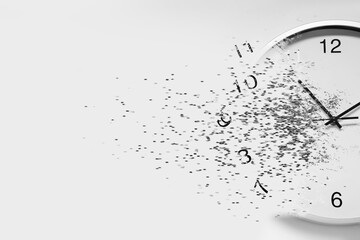 Time running out. Clock dissolving on white background
