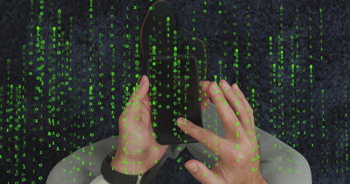 Man wearing shirt and jeans holding smartphone on dark blue carpet, with smartwatch and binary code - Powered by Adobe