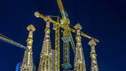 Sagrada Familia, a large church in Barcelona, Spain night timelapse.
