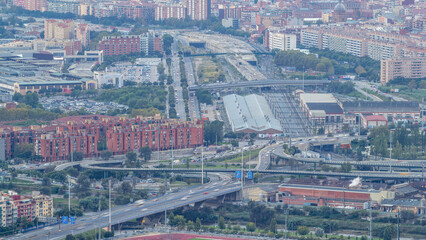 Barcelona and Badalona skyline with roofs of houses and sea on the horizon at evening timelapse