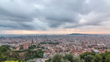 Fototapeta premium Panorama of Barcelona timelapse, Spain, viewed from the Bunkers of Carmel