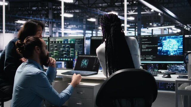 Data center software developers using machine learning algorithms to analyze large datasets. Server hub IT experts cooperating, using AI neural networks to recognize data patterns, camera A