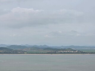 North Korean Landscape Seen from Afar with Mountains and Fields