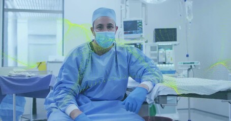 Camera zooming into OR showing surgeon adjusting posture among monitor and IV stand before surgery - Powered by Adobe