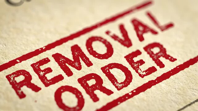 Red Removal Order Stamp on Beige Paper Texture Close Up Legal Document