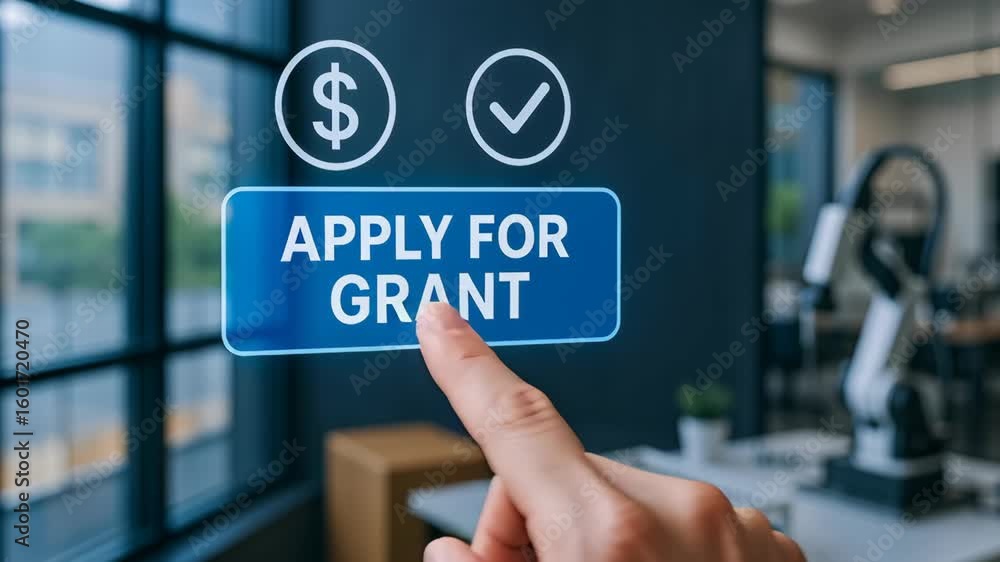 Aufkleber apply for grant funding by pressing button with finger in startup engineering lab featuring robotic 