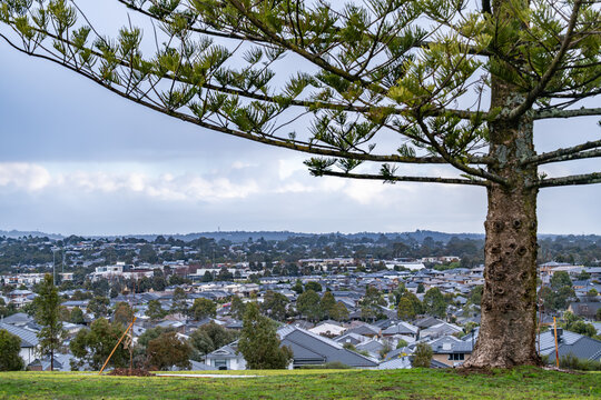 Elevated view of suburban housing in Doreen, a residential outer suburb of Melbourne, Australia. A growing suburb surrounded by green spaces at urban fringe. Concept of real estate, housing.
