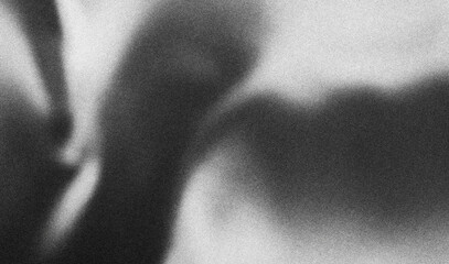 Grainy gradient subtly transitioning from light to dark, creating an abstract background with a...