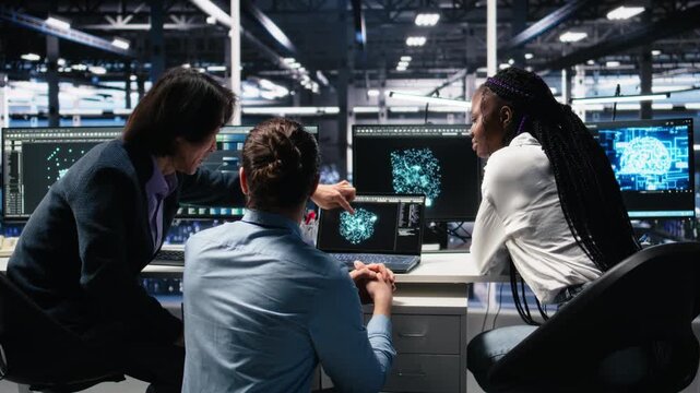 Server room computer scientists using AI to review infrastructure diagnostics. IT specialists working together in data center, analyzing performance data using artificial intelligence tech, camera A