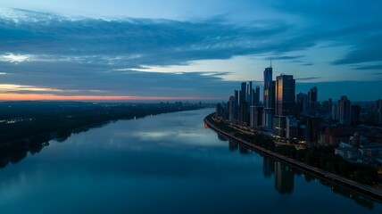 Fototapeta premium Modern city skyline at dusk with river reflection buildings skyscrapers