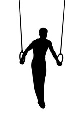 Silhouette of male gymnast on rings