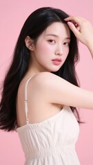 Naklejka premium ピンクの背景で髪に手をやる美しい女性