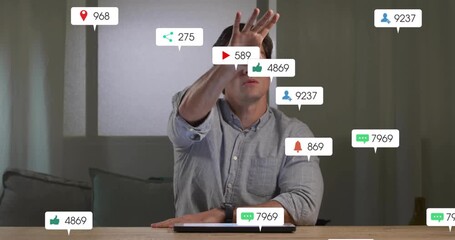 Adult man tapping table and swiping floating social media notification icons managing engagement - Powered by Adobe