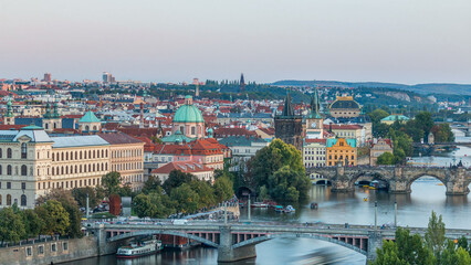 Obraz premium Aerial sunset view of the Vltava River and bridges evening timelapse, Prague
