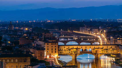 Skyline view of Arno River day to night timelapse, Ponte Vecchio from Piazzale Michelangelo at...