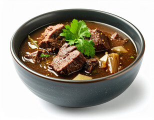 A bowl of rawon or black beef soup isolated on a white background