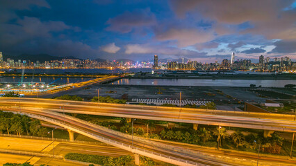 Fototapeta premium Hong Kong day to night, aerial view from kowloon bay downtown timelapse