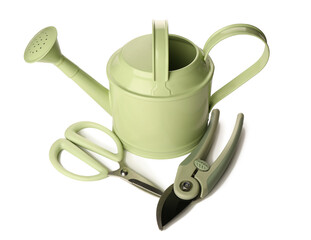 Watering can with floral scissors and secateurs on white background