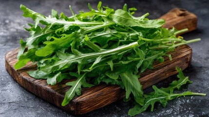 Fresh Arugula on Rustic Wooden Board