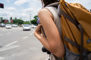 Traveling with Backpack at Urban Intersection