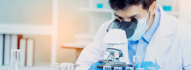 Banner Scientist man look Microscope research in science laboratory. Banner Asian scientist use...