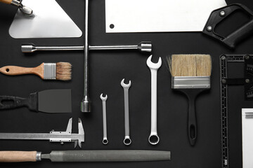 Set of construction tools on black background